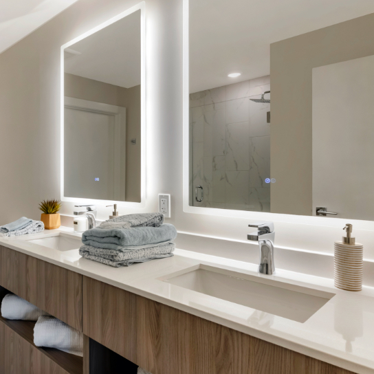 Bathroom sink with lighted mirror